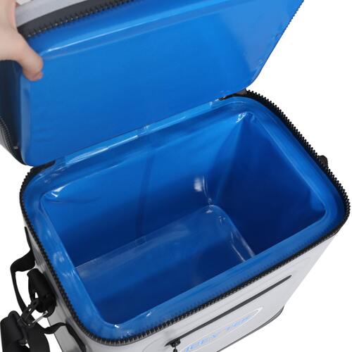 Blue cooler bag with a hand opening it on a white background
